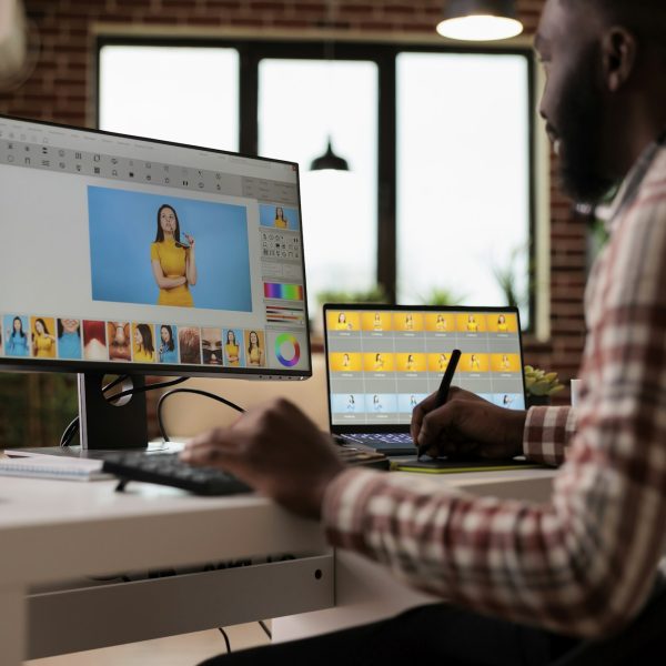Content creator editing picture with retoucher software